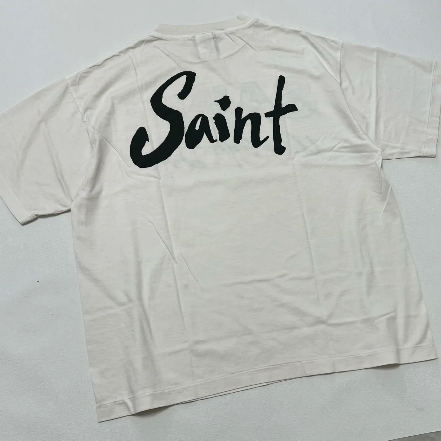 SAINT Mxxxxxx SS TEE/SUPER DIRTY/WHT oil painting SAINT SUPER DIRTY slogan TEE off-white S-XL Made of original OE yarn tube weaving without side seams to distinguish the split fabrics original consistent VINTAGE label/little angel anti-counterfeiting label top printing technology highly restored original details